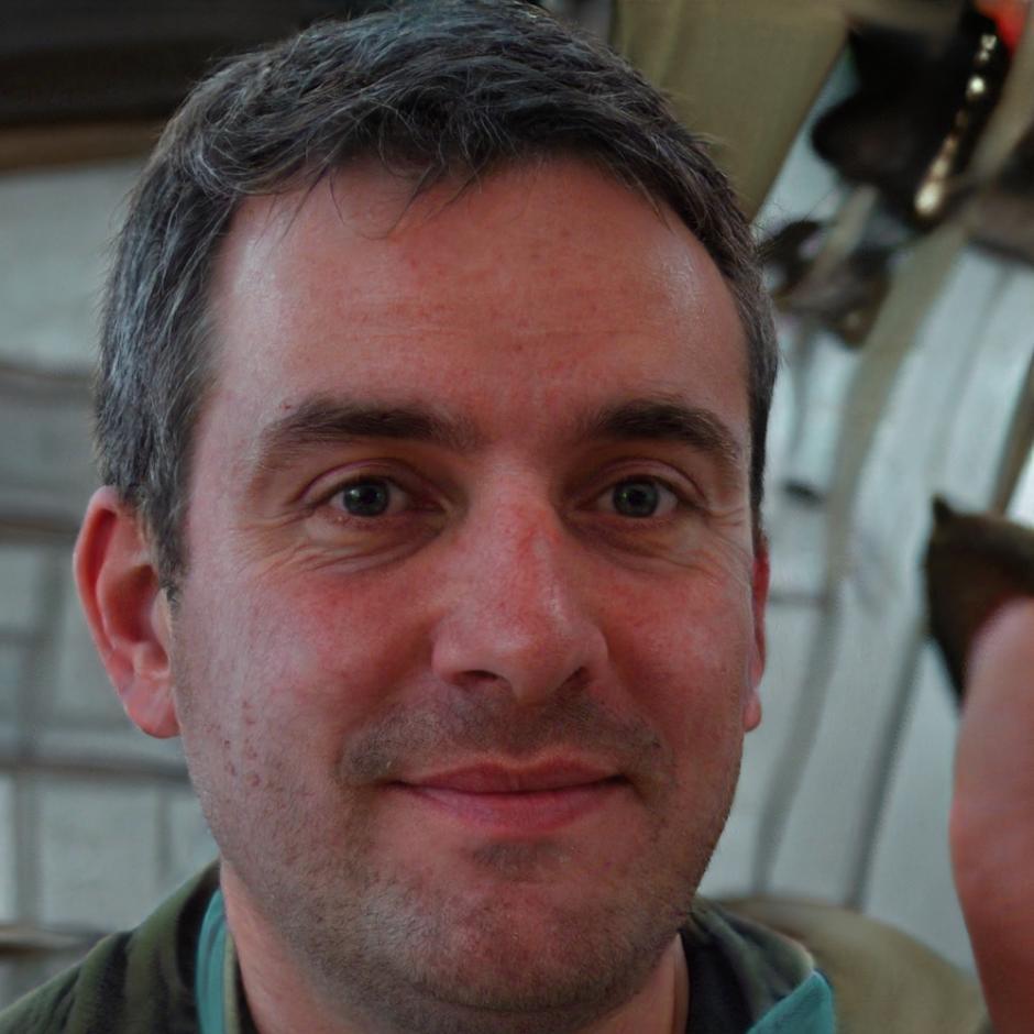 Professional headshot of team member